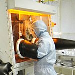 Researcher working in the COPE clean room