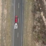 Drone view of highway showing a vehicle