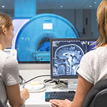 Two people looking at advanced brain imaging