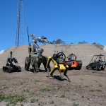 Group of land robots on a small hill