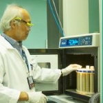 Researcher unloading laborator analysis equipment