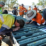 Geologists investigating drill core