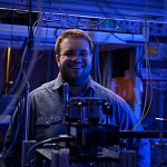 Researcher in blue-light laboratory
