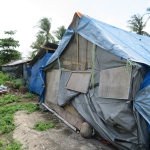 Home patched together with tarpaulins after the Lombok earthquake